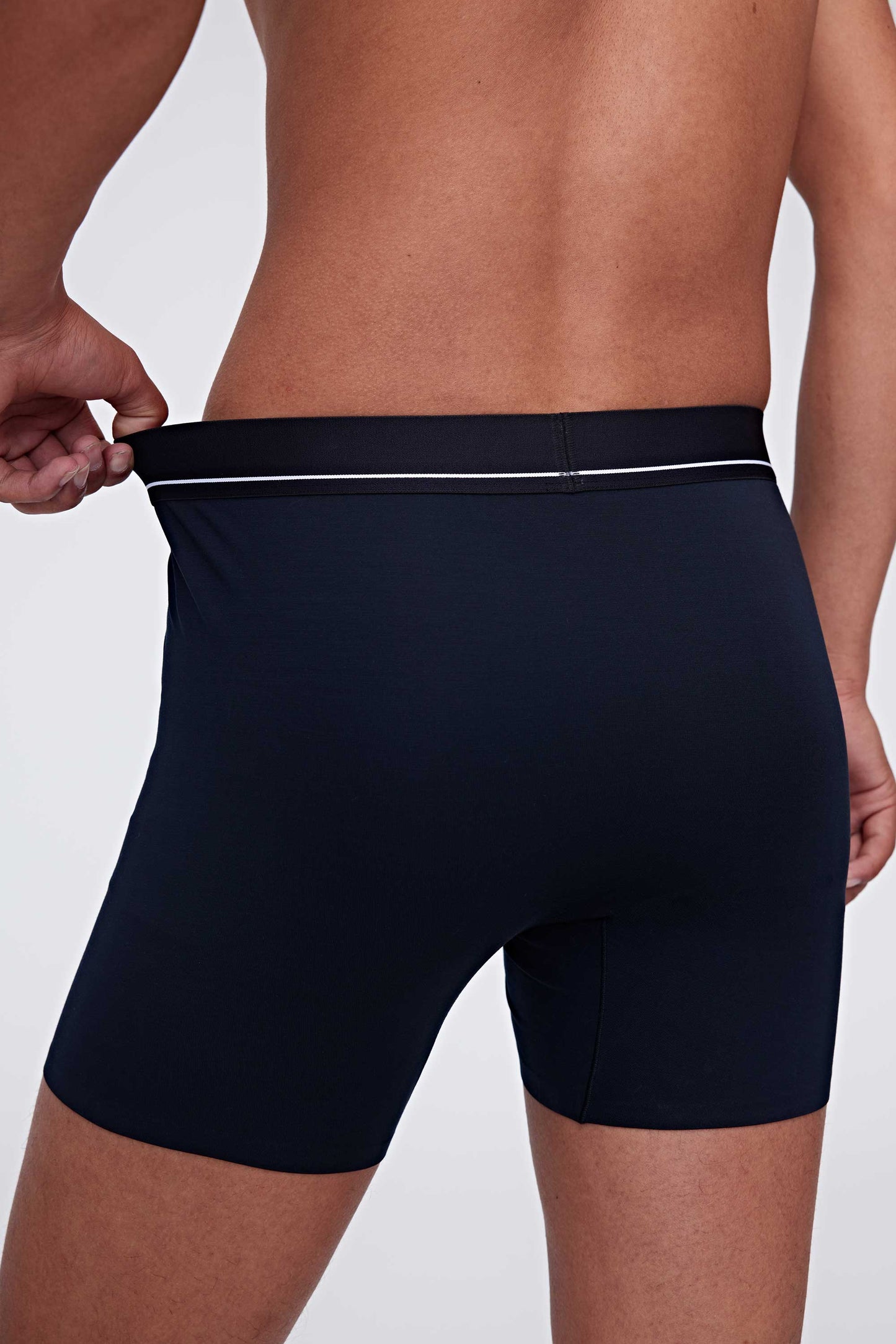 back of man in blue brief