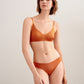 woman in orange bra and brief