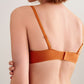 back of woman in orange bra