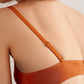 back of woman in orange bra 
