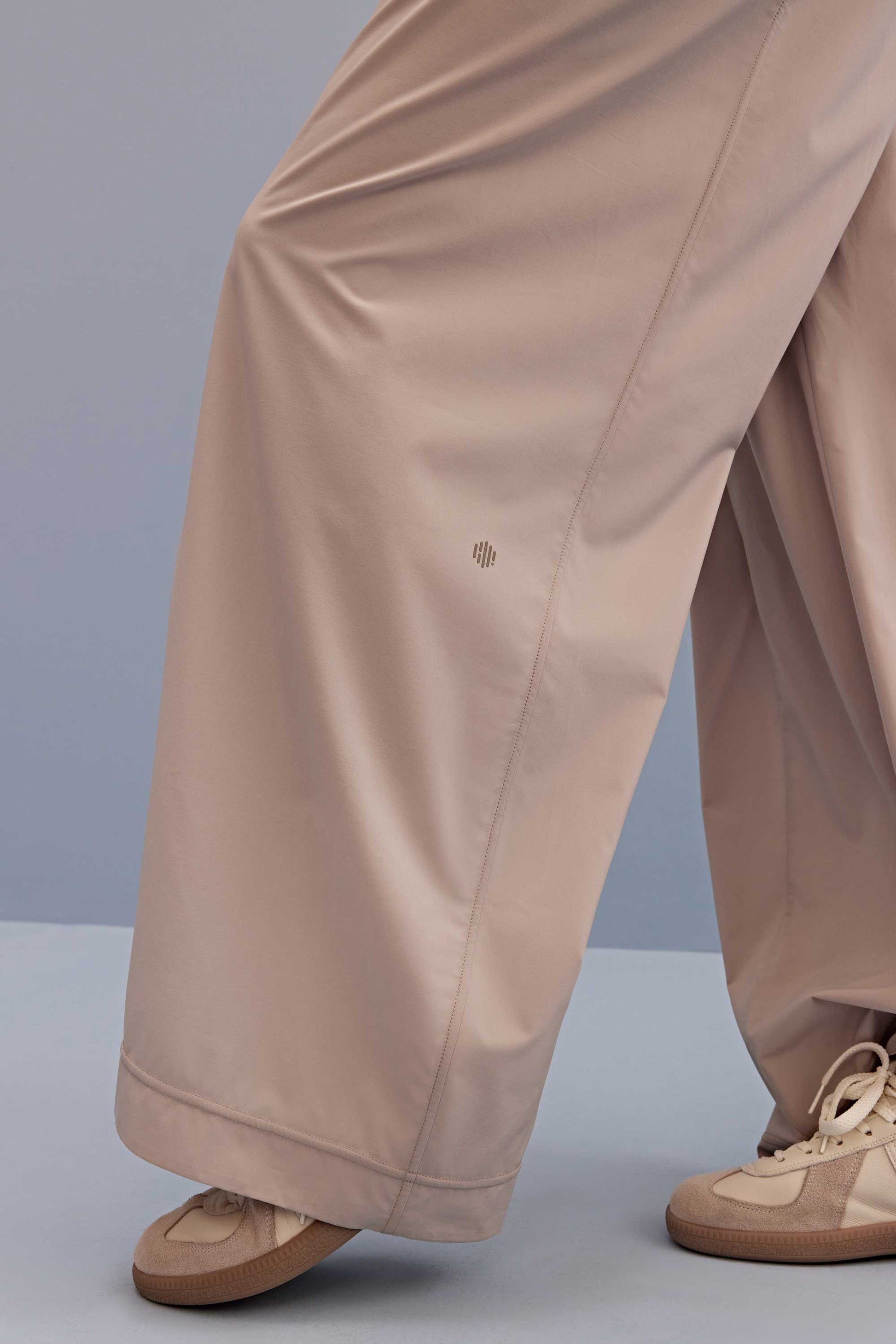 detail of light beige wide leg pants