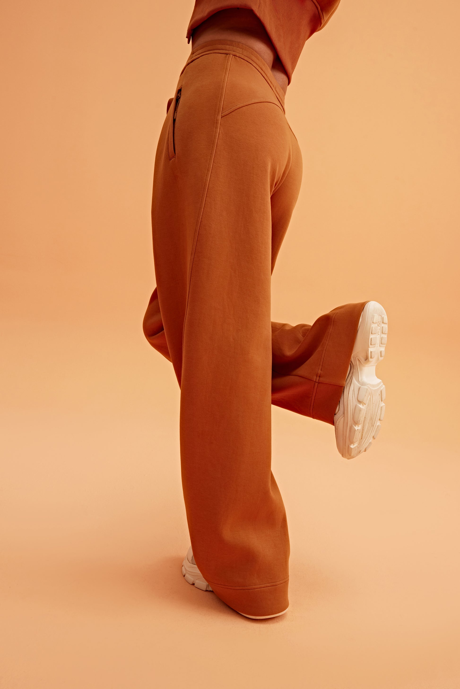 woman in caramel wide leg pants