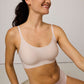 Woman wearing off-white tank bra and matching briefs