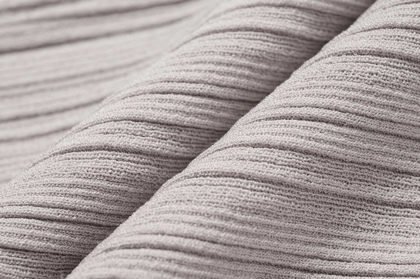 fabric detail of light grey shrug