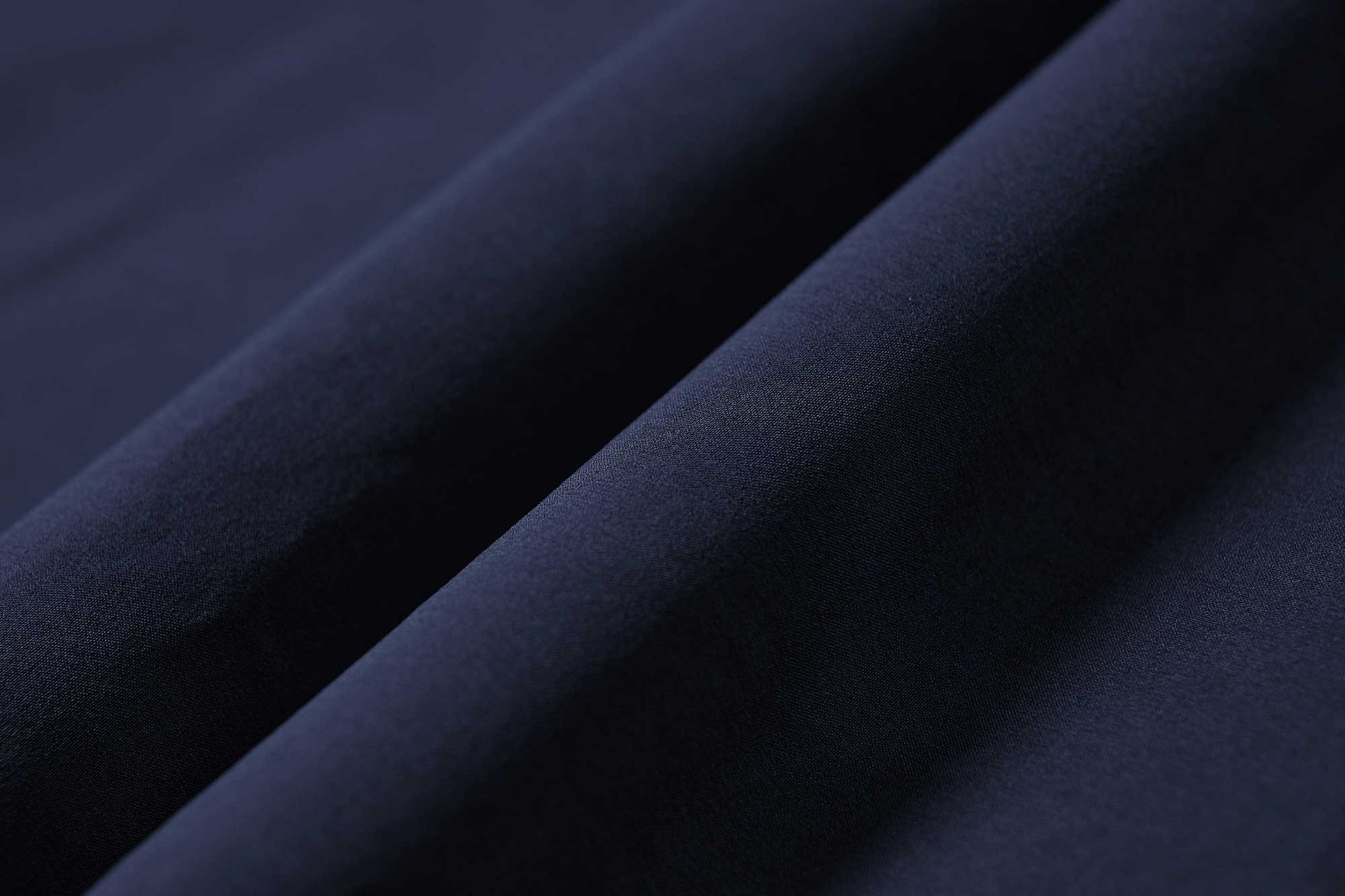 fabric detail of navy pants