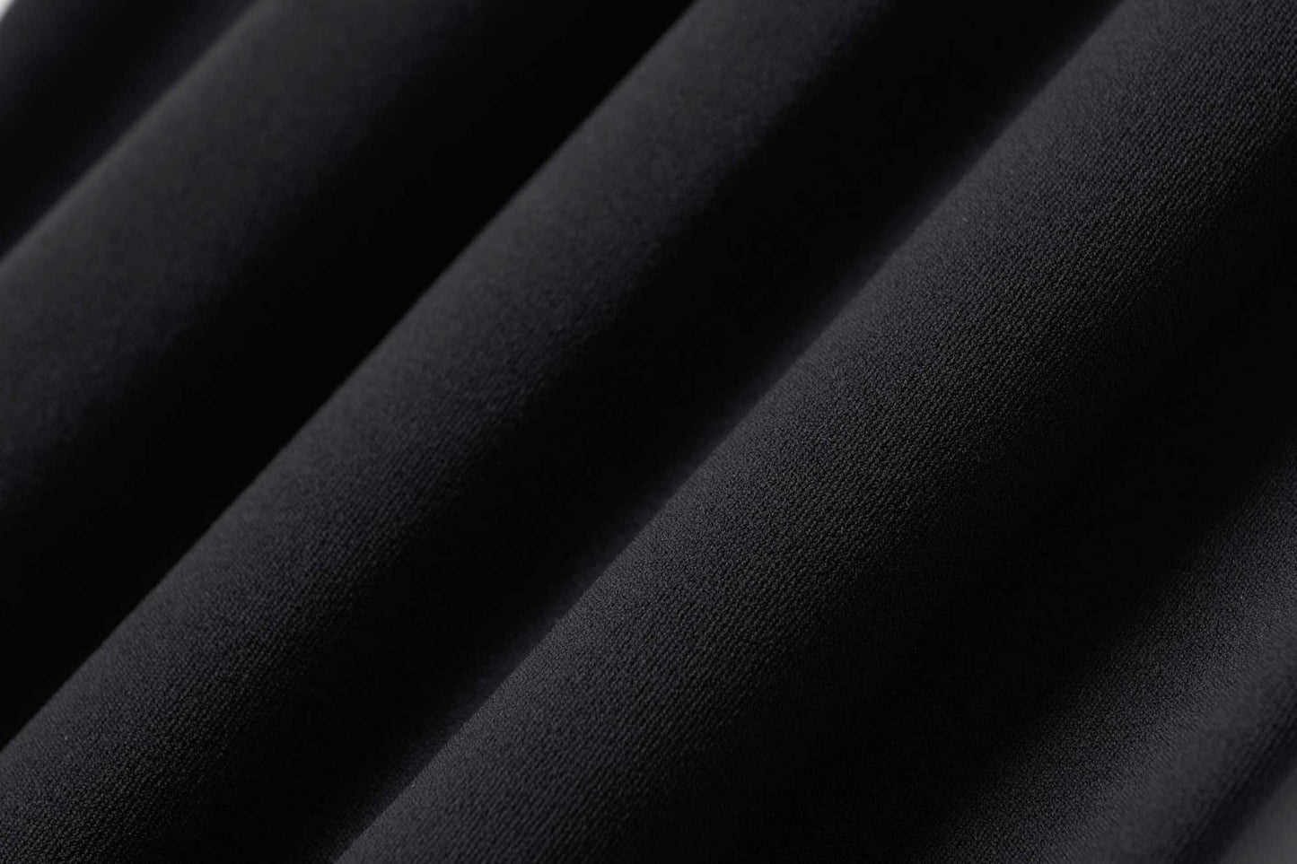 fabric detail of black leggings