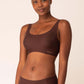 Woman wearing brown bra with thick straps and matching birefs