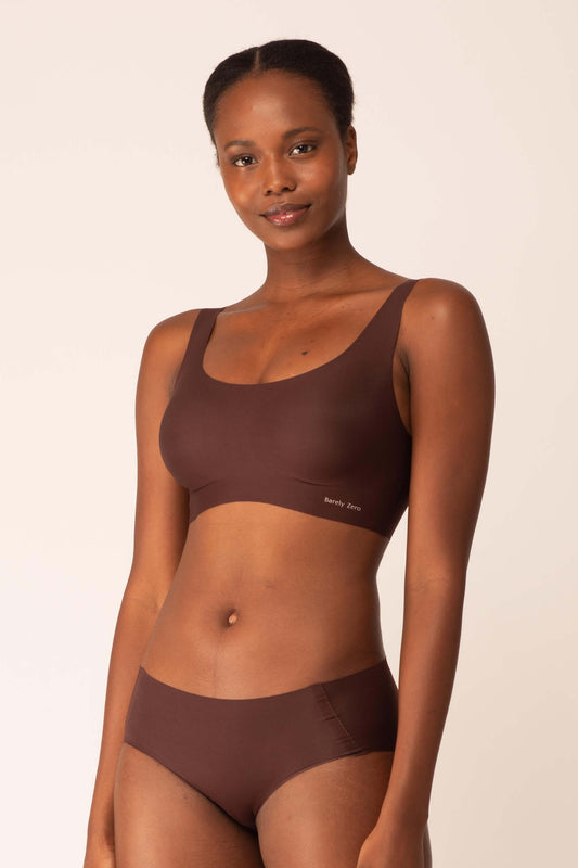 Woman wearing brown bra with thick straps and matching birefs