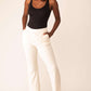 woman in black bodysuit and white pants