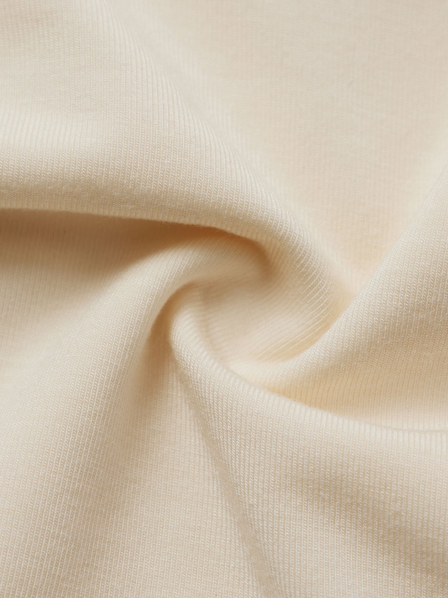 Close-up of beige fabric with folds