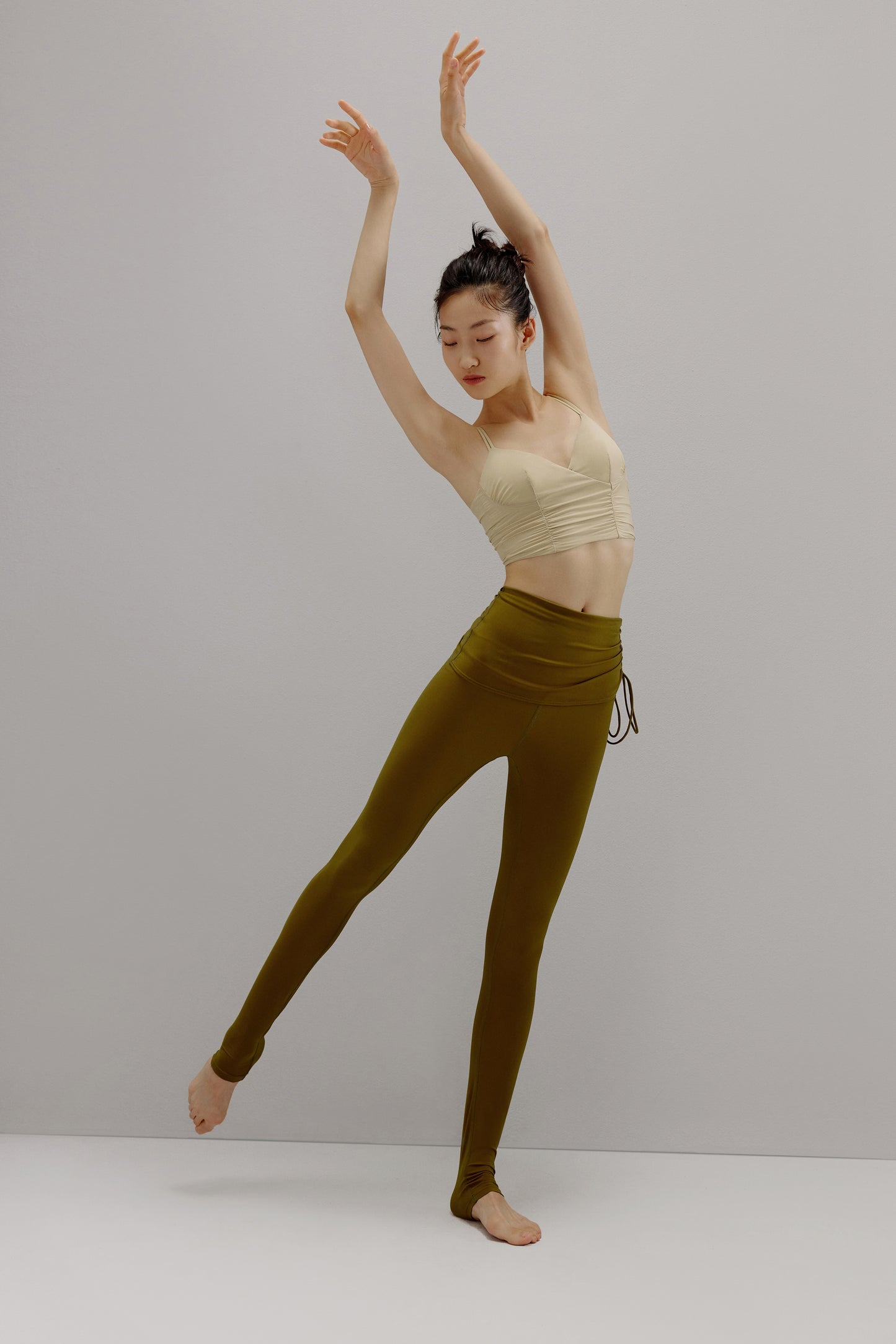 women in brown top and leggings