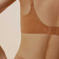 The back of woman wearing caramel bra