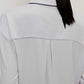 back of a woman wearing a light blue pajama top