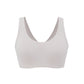 Flat lay image of off-white bra with thick straps