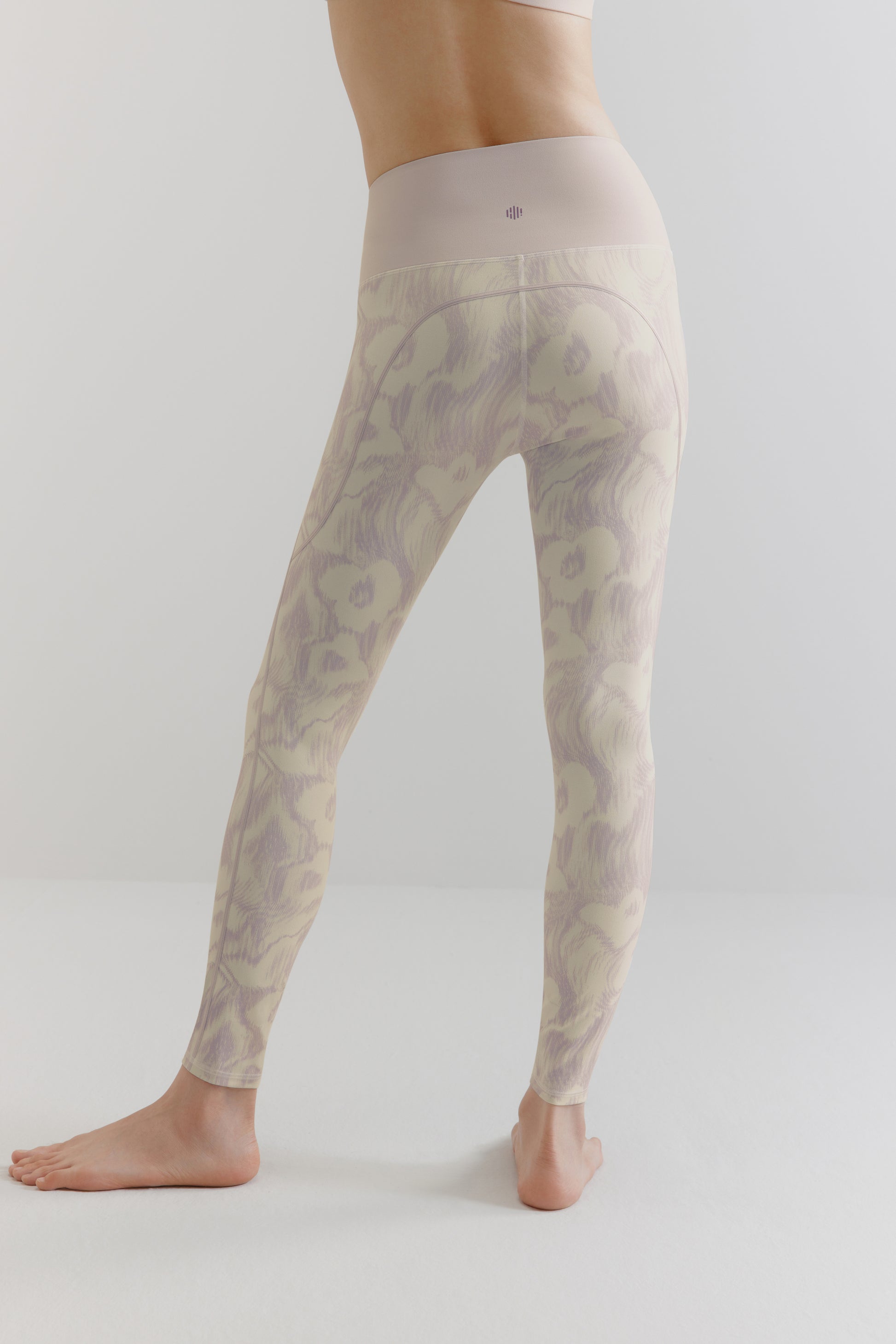 The back of the purple and white patterned leggings.