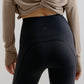 back of the gray long-sleeved shirt and navy leggings