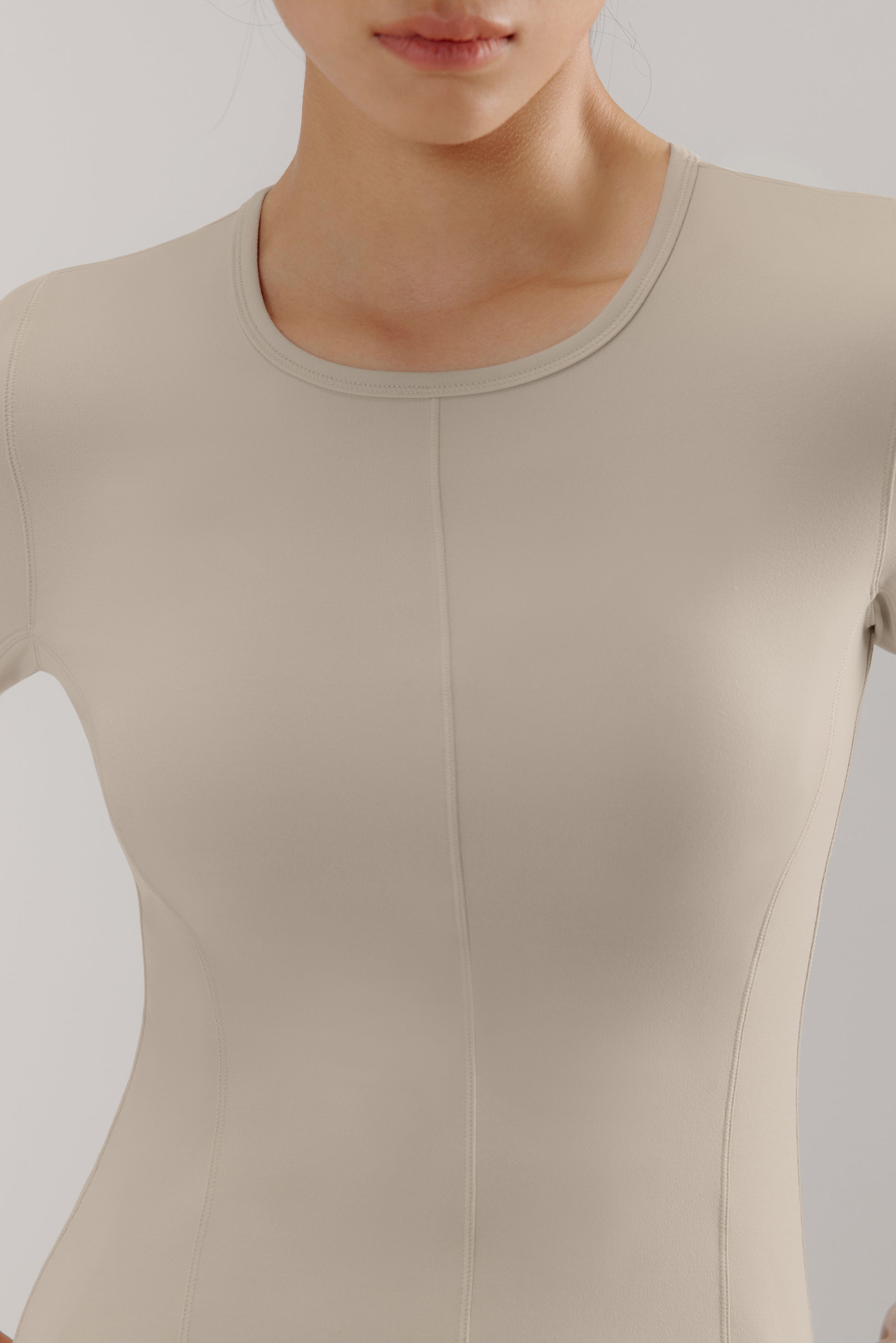 close up of a grey mousse long sleeve sports top