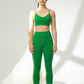 woman wearing green sports bra and leggings