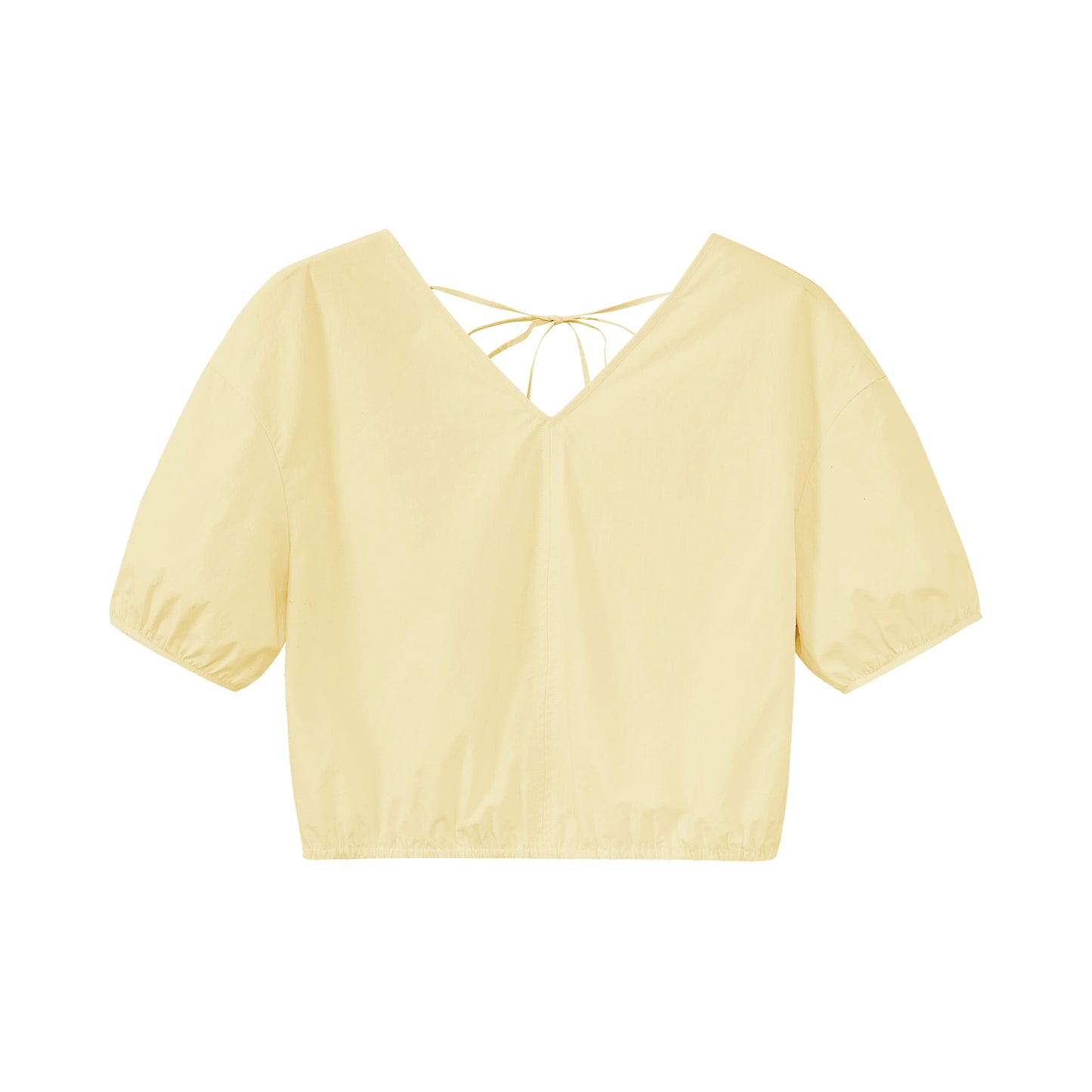 Flat lay of yellow top.