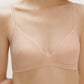 A woman wearing a nude bra