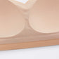 the inside of a nude color bra showing sewed in pads