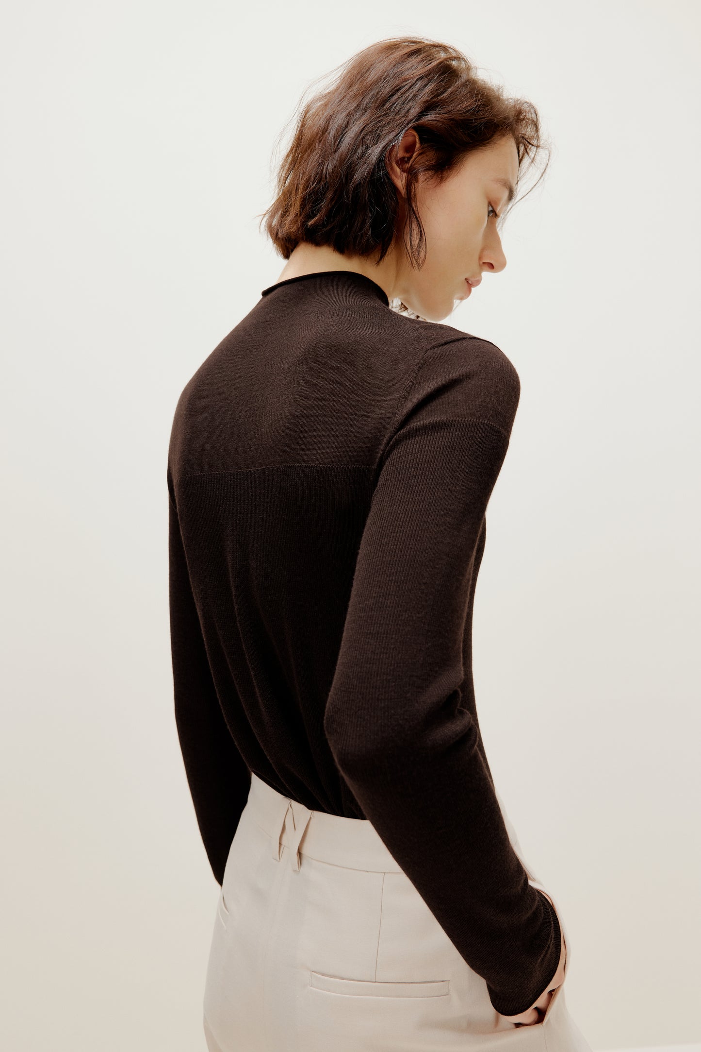 brown silky wool mock neck sweater from back