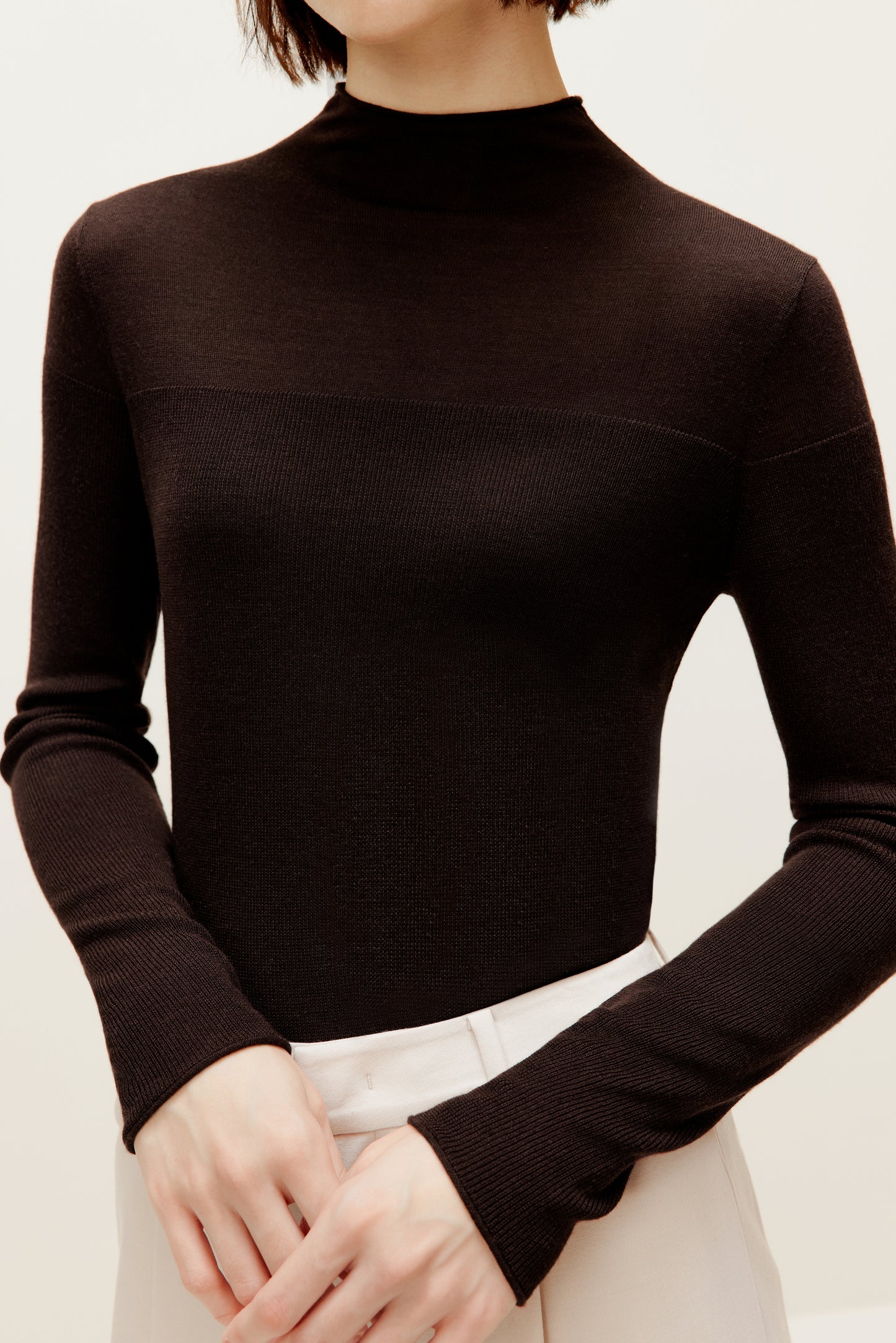 a brown silky wool mock neck sweater