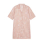 flay lay of pink pajama dress with white sketches