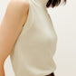side view of the white silky wool mock neck sleeveless sweater