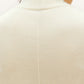 white silky wool mock neck sleeveless sweater from back