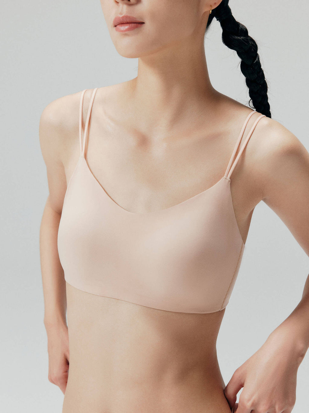 Closeup of nude bra with double straps.