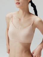 Closeup of nude bra with double straps.