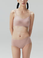 Model wearing bra and brief set in the color Clay Pink