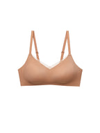 A seamless wireless bra in a warm nude beige color, featuring thin adjustable shoulder straps and a subtle white lace trim along the V-neckline, shown against a plain white background. Sandstone