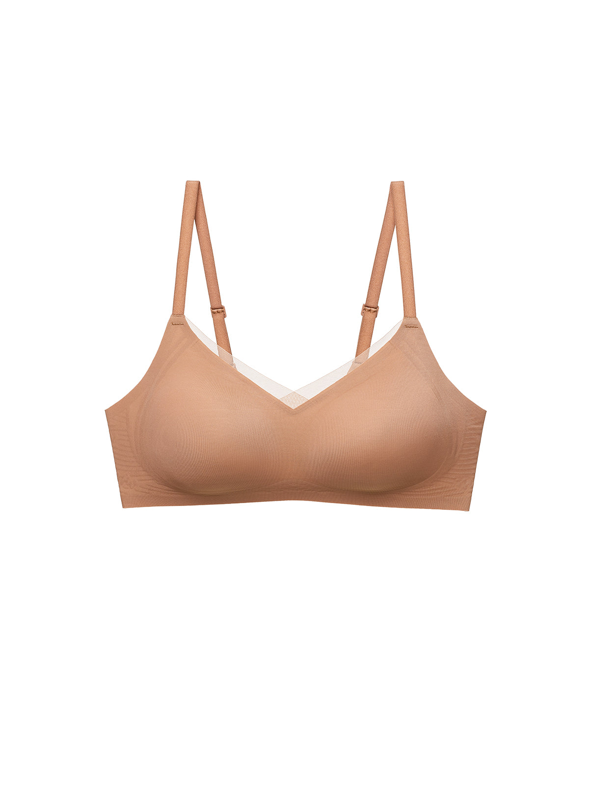 A seamless wireless bra in a warm nude beige color, featuring thin adjustable shoulder straps and a subtle white lace trim along the V-neckline, shown against a plain white background. Sandstone