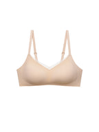 A light beige wireless underwire bra with adjustable shoulder straps, shown against a plain white background.Toasted Almond