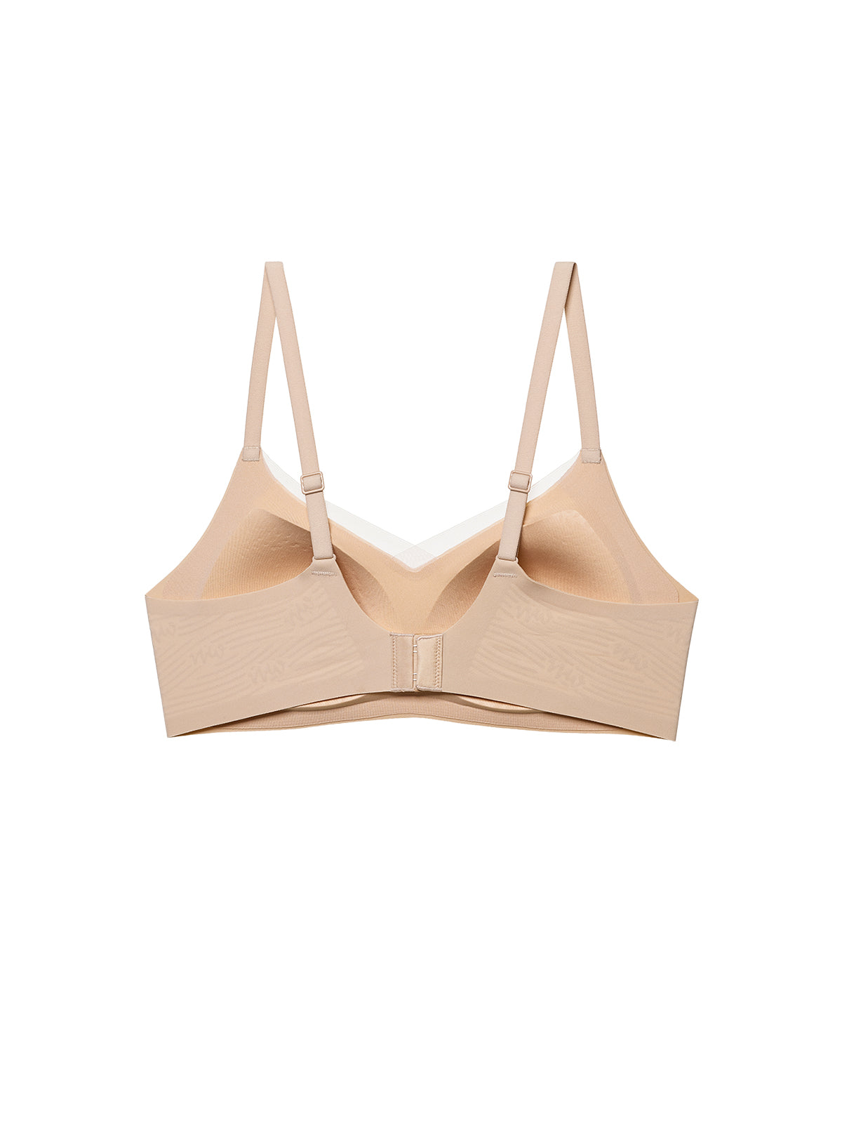 A beige wireless underwire bra with adjustable shoulder straps, displayed flat against a solid white background. Toasted Almond
