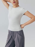 Model wearing white tee.