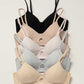 flat lay of five bras include black color bra, nude color bra, light pink bra, light blue bra and beige bra 