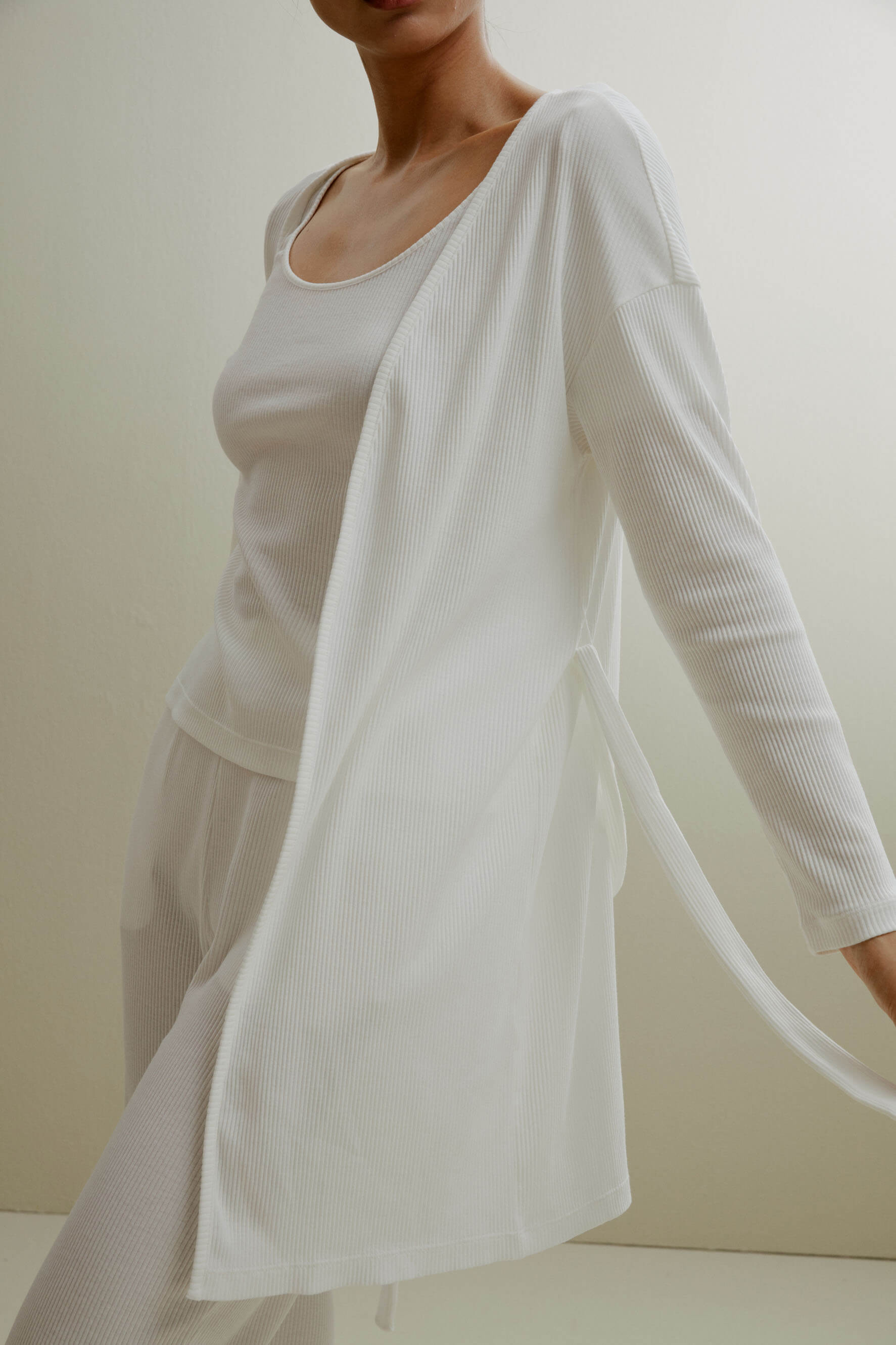 women in white ribbed cardigan and pajamas set