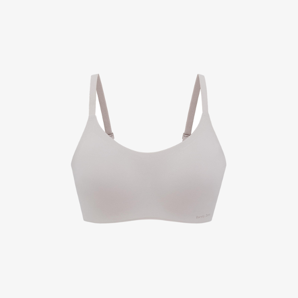 Light beige Barely Zero Spaghetti Strap Bra - TikTok, featuring smooth seamless cups, thin adjustable straps, and CloudFit technology for all-day comfort, displayed on a plain white background.