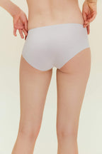back view of woman wearing offwhite underwear. Fluffy Peach color.