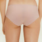 Back view of woman wearing beige underwear