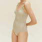 woman in light golden swimsuit