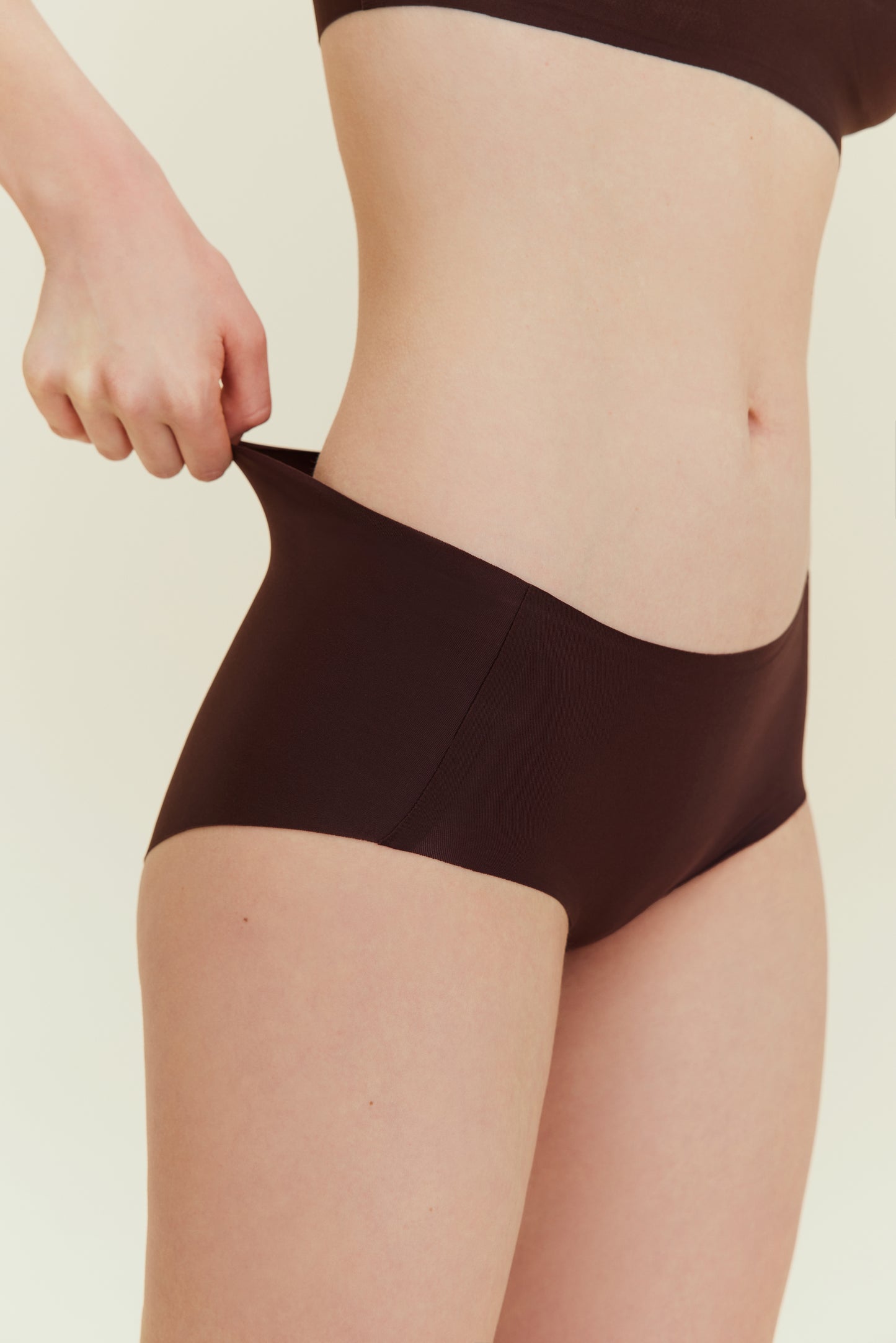 side view of woman in brown underwear