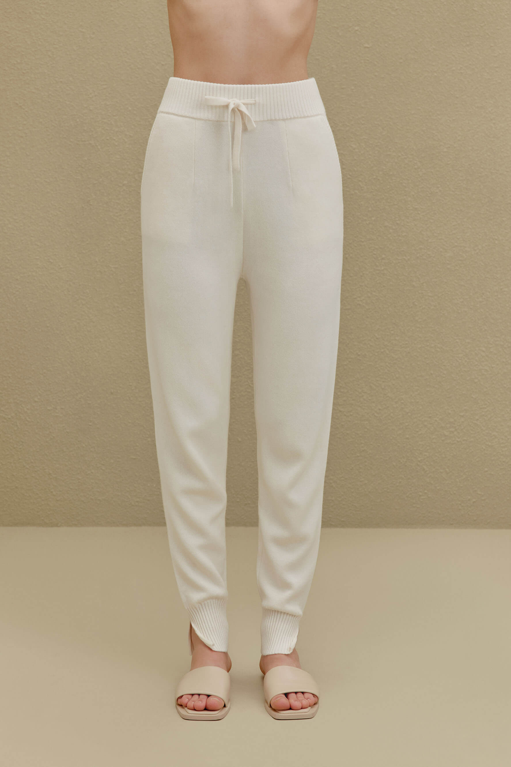 women in white knitted joggers