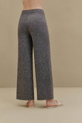 Woman in black wide-leg pants