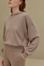 A woman wearing a Camel hoodie and pants