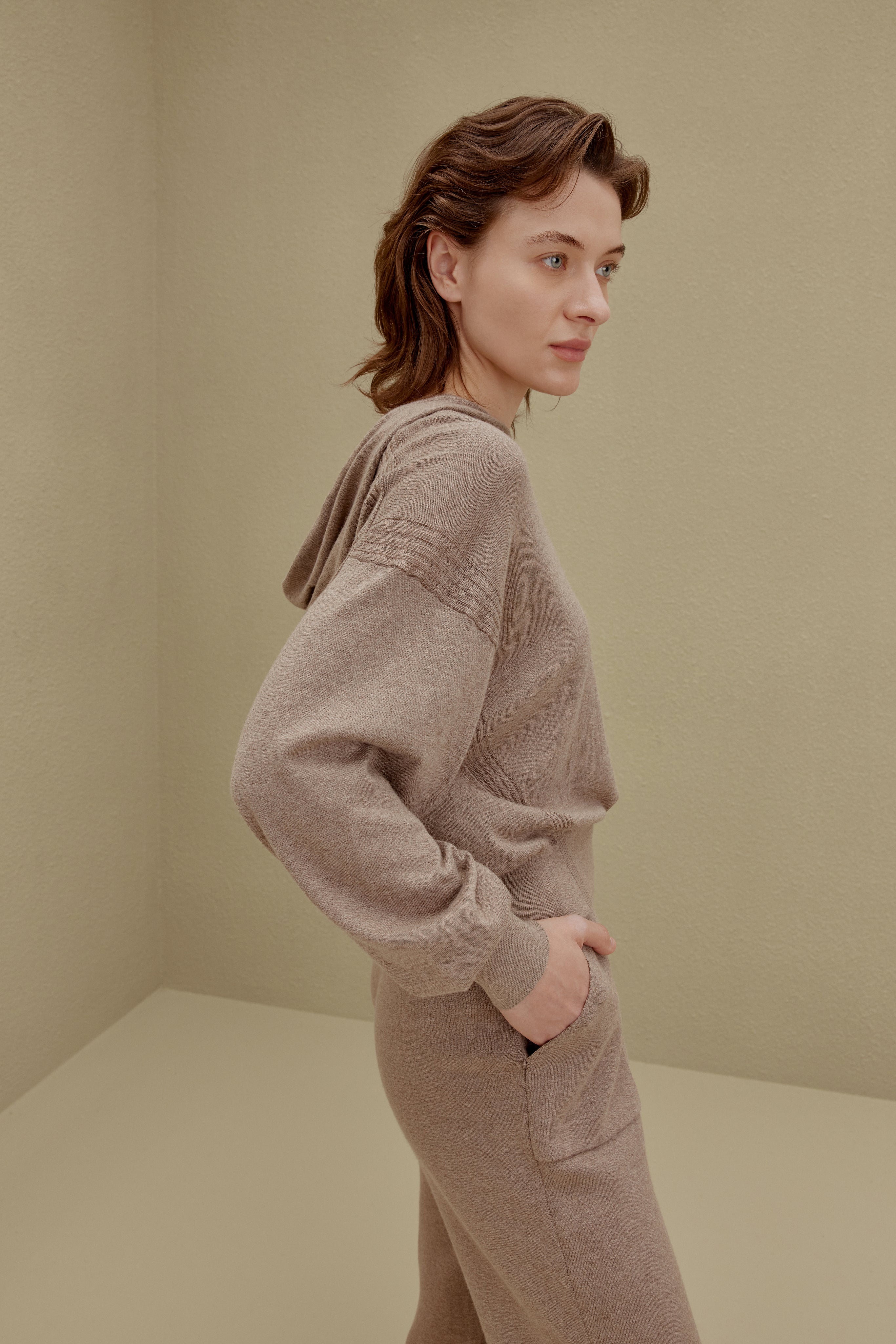 A woman wearing a Camel hoodie and pants