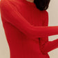 woman in red sweater 